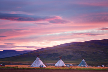 Landscape at sunrise, dwellings of nomads and mountains, Russia, Yamal