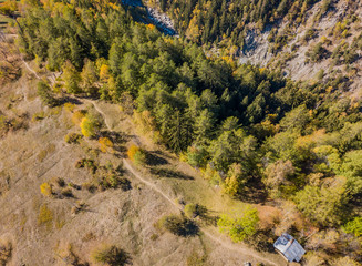 Fototapeta na wymiar Aerial view of hiking trail in mountaineous area in Switzerland in Canton of Valais