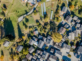 Aerial view of tiny houses in rural village in Swiss mountains in Canton of valais