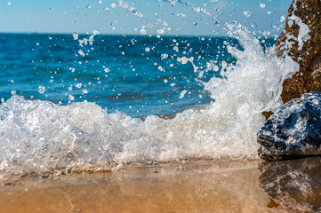 The sky and blue sea hit the rocks dramatic.
Spread splash day outdoor no people  shore.