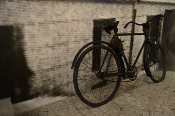 Fototapeta na wymiar Closeup retro style bike with grey blurred background