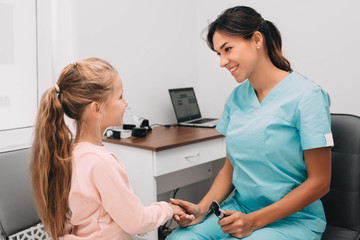 Handshake with little patient, at medical office. Consultation and reception of the children's doctor