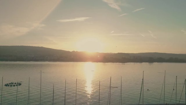 Aerial view of masts of sailboats on the lake Zurich at sunrise, Switzerland