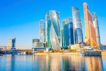 modern skyscrapers of downtown Moscow and reflections in the Moscow River. Russia