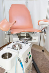 Gynecological cabinet with chair and other medical equipment in modern clinic