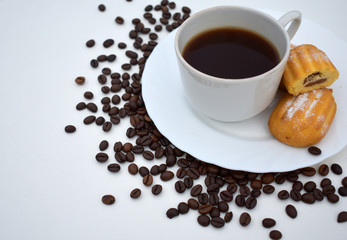 Coffee in a Cup with pastries on a white background.