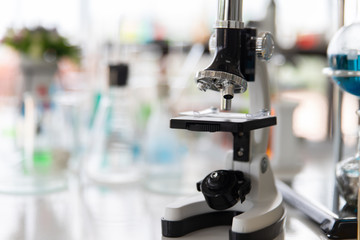 Microscopes and test tubes For scientific research in the chemistry laboratory on the table.