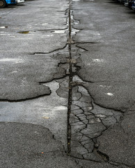 Very damaged and cracked parking space