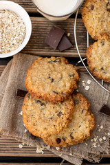 Oatmeal cookies with chocolate served with milk