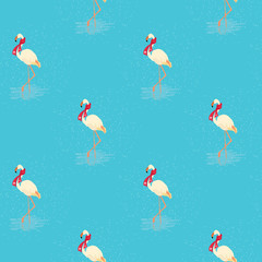 Obraz premium Seamless pattern of white flamingo in a red scarf standing in water on one leg in winter. Vector illustration of exotic bird on blue background. Wildlife concept.