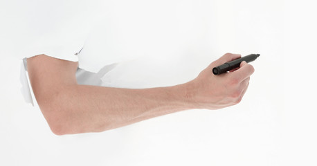 close up.a man writes a marker on a broken paper wall