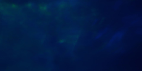 Abstract dark blue background with a green glow, like the northern lights.