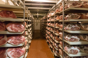 BOLOGNA, ITALY. May 02, 2018: Sorage of prosciutto in ham factory in Bologna, Italy