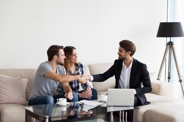 Young couple, family at meeting with realtor, interior designer, decorator, landlord making deal....
