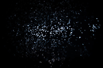 Shards of glass on the black background