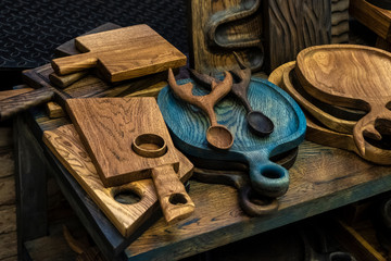 many handmade wooden cutting boards.