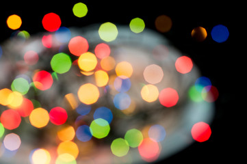 Colorful bokeh background. Blurred garland lights. New Year and Christmas decorations. Celebrations and holidays concept