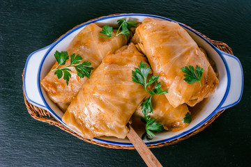 Stuffed cabbage rolls with rice and meat in tomato sauce