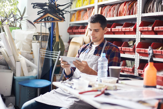 Man using tablet in workshop