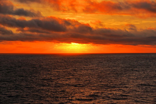 A color image of the sun setting over the North Sea as seen from the balcony of a cruise ship.