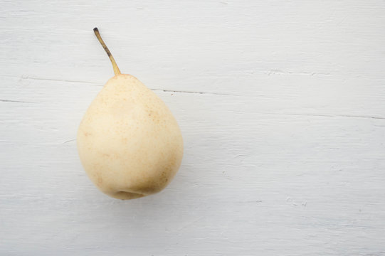pear on a light wooden background