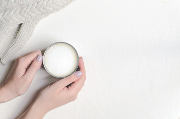 Fototapeta na wymiar Coffee Mug in Female Hands, Winter Background, Winter Cozy Still Life Concept, Flat Lay, Top View