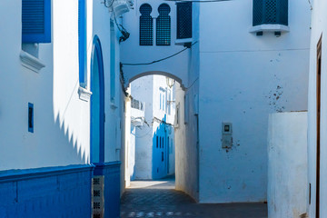 Beautiful street of white ancient medina of the Asilah village in Morocco