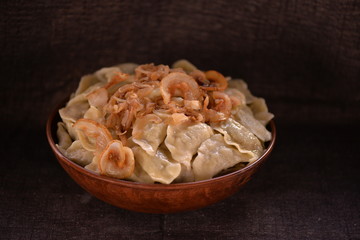 many dumplings in a clay bowl, series