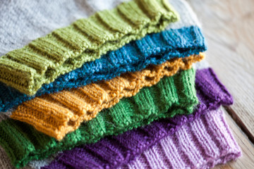 Multicolor knitted hats stack.