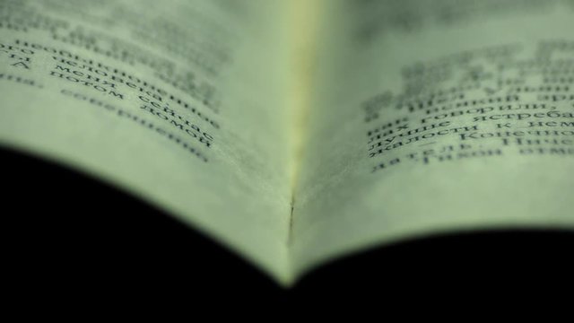 Open book. Book with macro. Fly over the book.