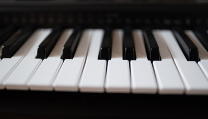 Close up view of electric piano keys.