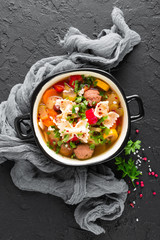 Italian minestrone soup with beef meatballs, vegetables and pasta in bowl