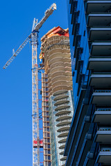 Fototapeta na wymiar Construction crane in Vancouver Canada building another high-rise