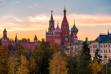 Moscow, Capital city of Russia. Beautiful view of Saint Basil`s Cathedral during sunset time. Clouds are in purple and orange colors.