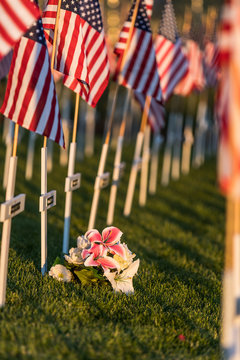 Flowers and American flag patriotic memorial