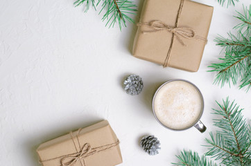 Obraz na płótnie Canvas Winter Concept, Christmas Presents, Coffee Mug, Pine Cones and Braches, Cozy Still Life Background