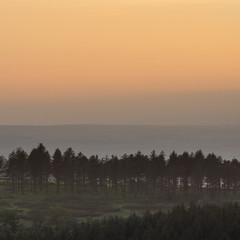 Stunning Autumn sunset landscape image of view from Leather Tor towards Burrator Reservoir in Dartmoor National Park