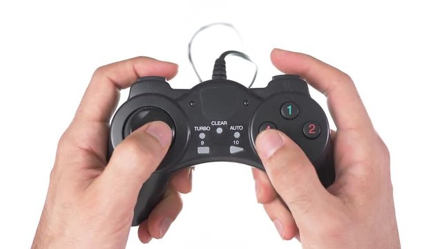 Hands on a gaming controller being used against a white background