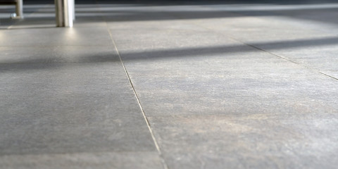 on the floor the sun's rays. The Shine of sunlight on pressed Sandstone paving slabs is an unusual...
