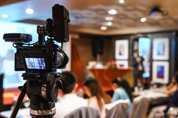 Black mirrorless camera recording seminar with optional accessory, technology transformation of...