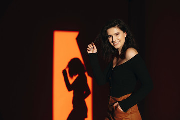 Smiling woman touching hair