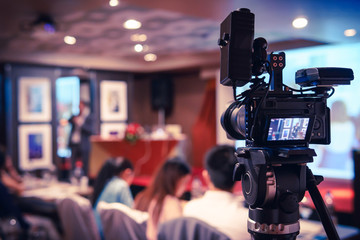 Black mirrorless camera recording seminar with optional accessory, technology transformation of...