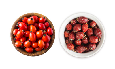Fresh and dried rosehip berries on white background. Top view. Rosehip berries in a bowl isolated on white background. Rose hip berries with copy space for text.