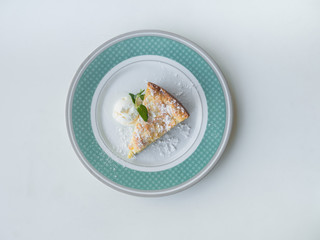 Sweet dessert: Apple pie with ice cream on a plate. Top view. 


