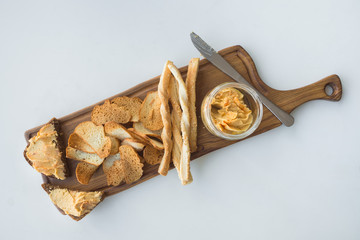 Traditional Middle east appetizer Hummus served with chips of bread and herbs.
