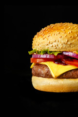 fresh tasty burger and on dark background
