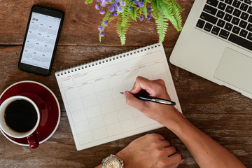 SEPTEMBER 17, 2018: Working table top with organizer for monthly planing with Iphone 8 plus use...