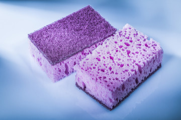 Obraz na płótnie Canvas New violet cleaning sponges on white background