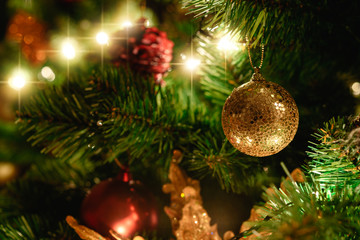 Close up christmas tree decorated with christmas balls and light