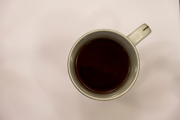 red tea in a white cup